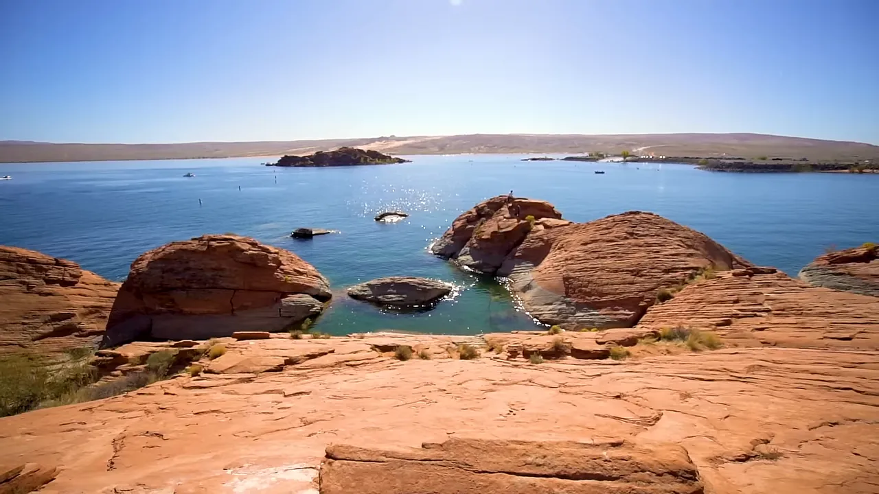 Man-made reservoir suitable for boating and cliff jumping illustrating open-water recreation near southern Utah communities