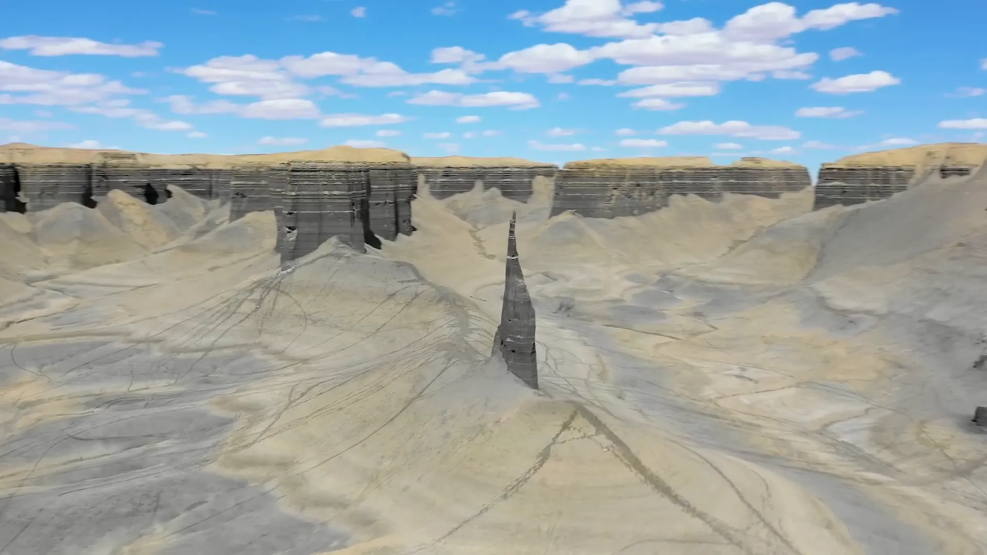 Jagged Hoodoo rock formation surrounded by cliffs at Factory Butte