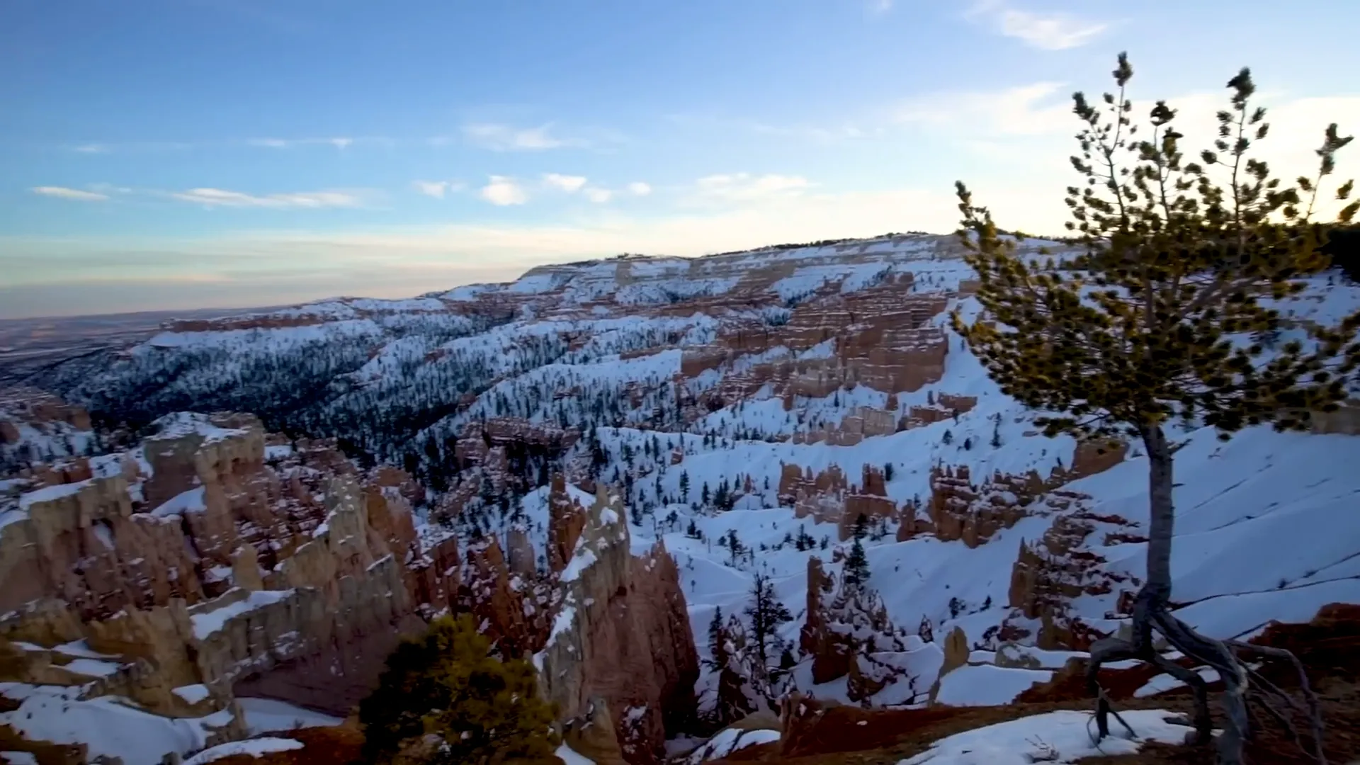 Snow-covered hoodoos at Bryce Canyon at sunset