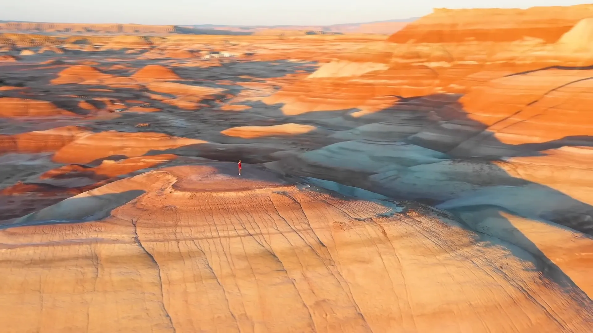 Sunrise over Mars-like red and purple rock layers in Utah