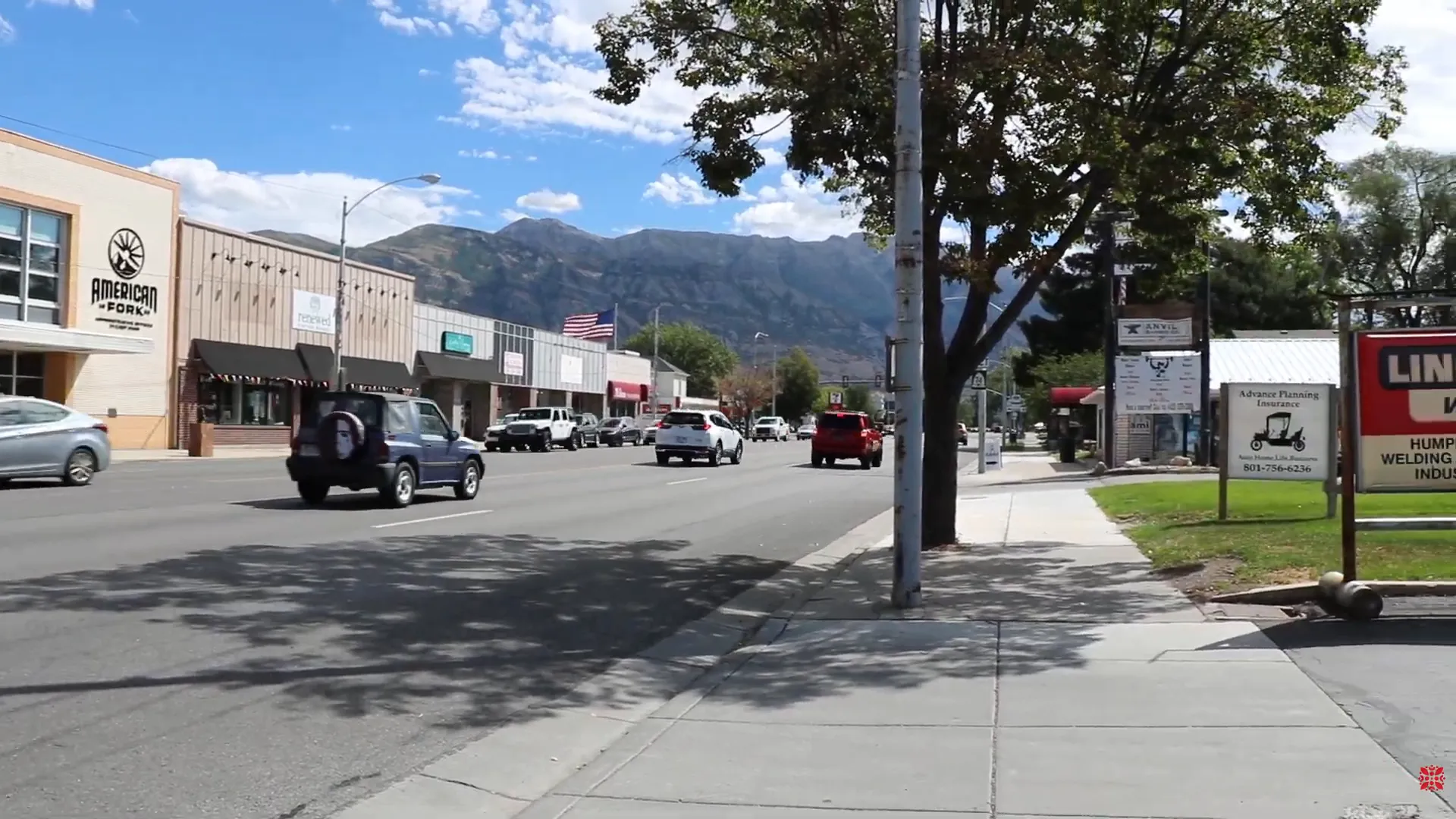 Farmers market with food trucks and vendors on Main Street in American Fork