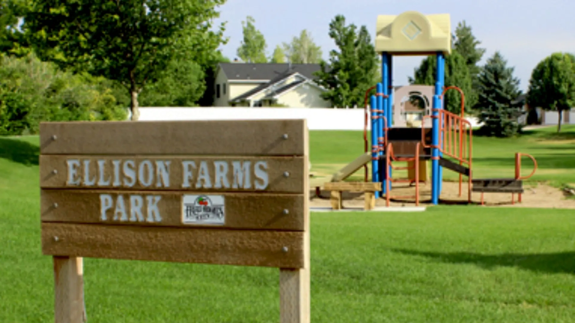 Park in Fruit Heights with green fields and walking paths