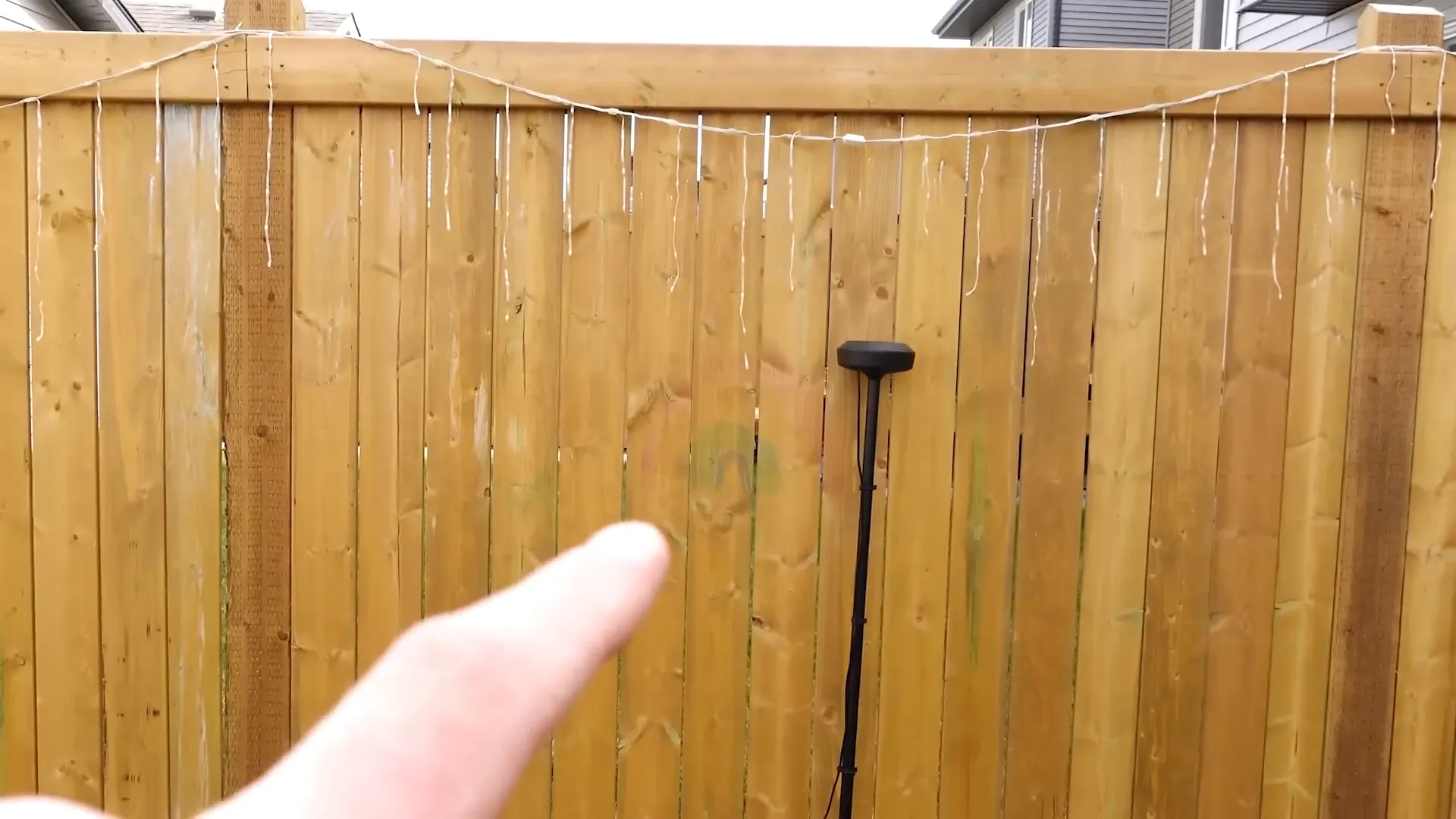 RTK antenna staked in ground with cable management