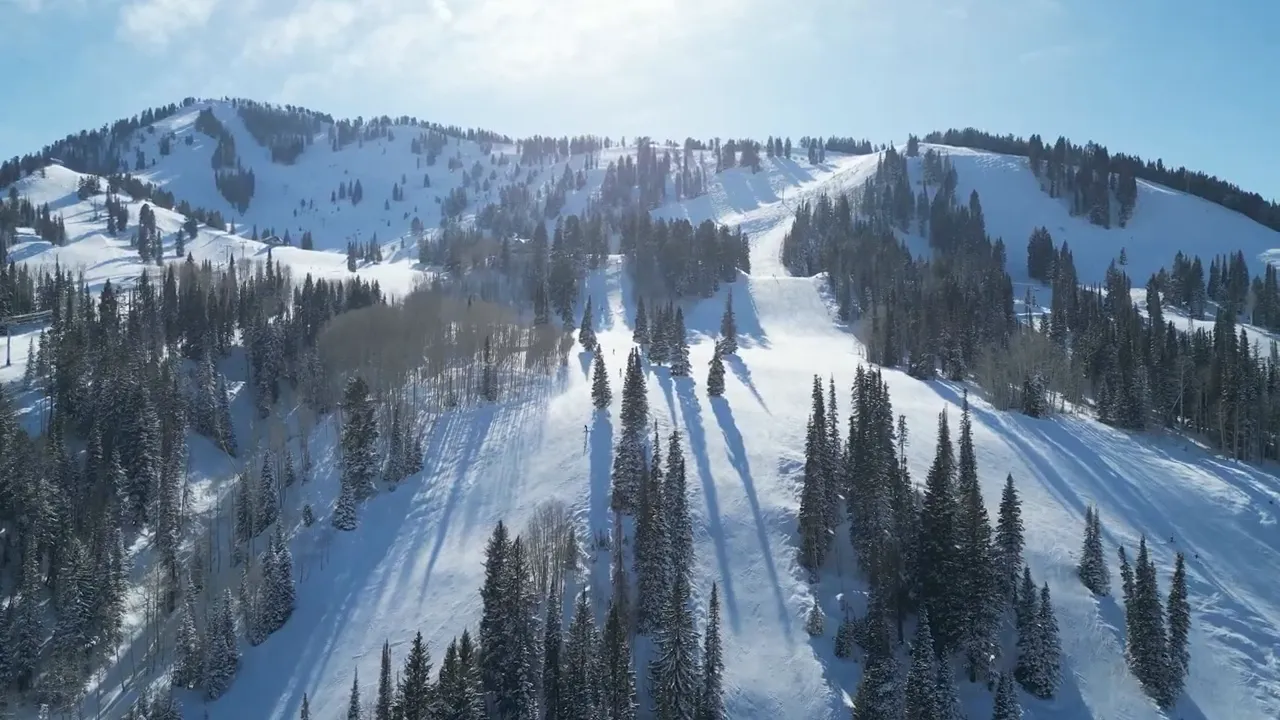 Ski lift at a Utah ski resort with snow-covered slopes