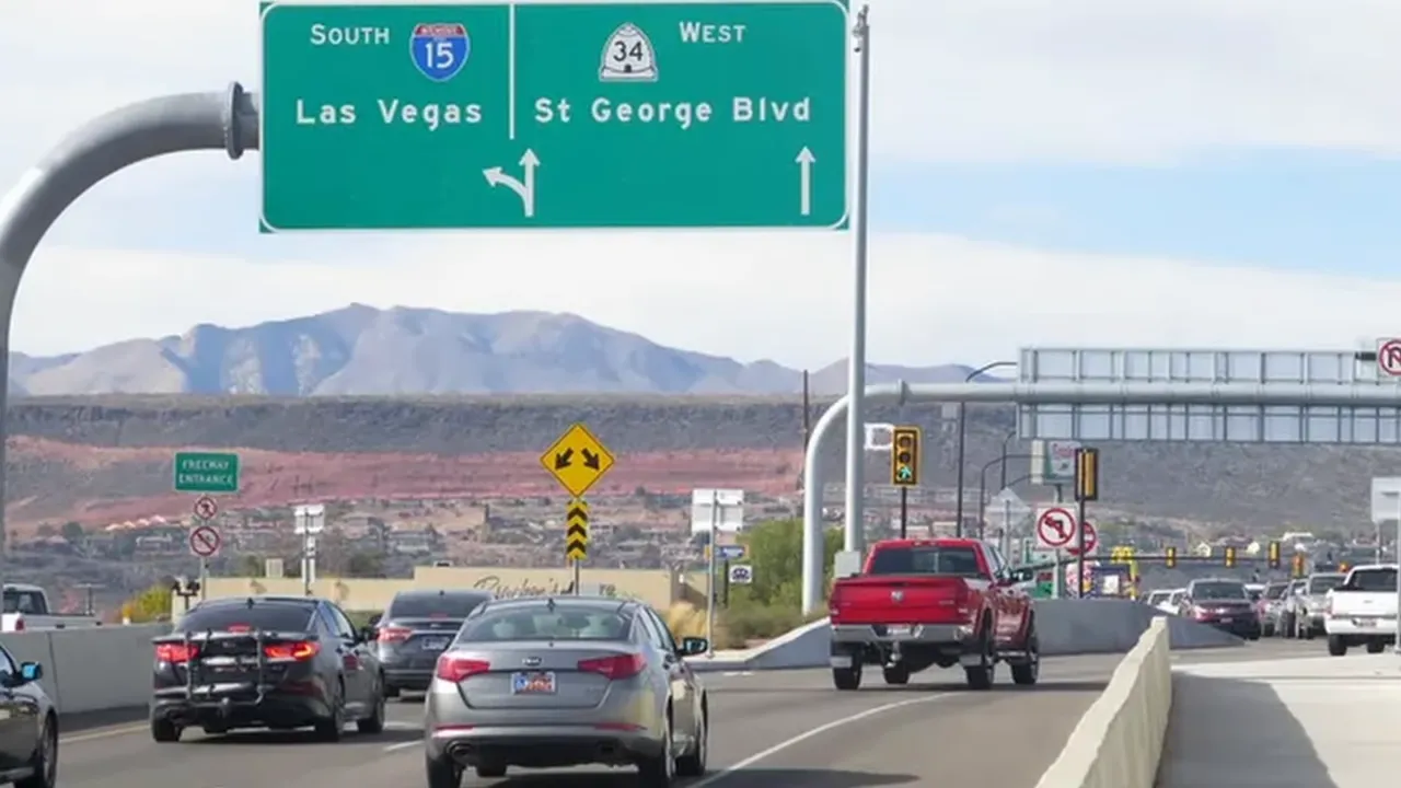 Clear view of highway sign for South I-15 and St George Blvd with congested traffic on the ramp