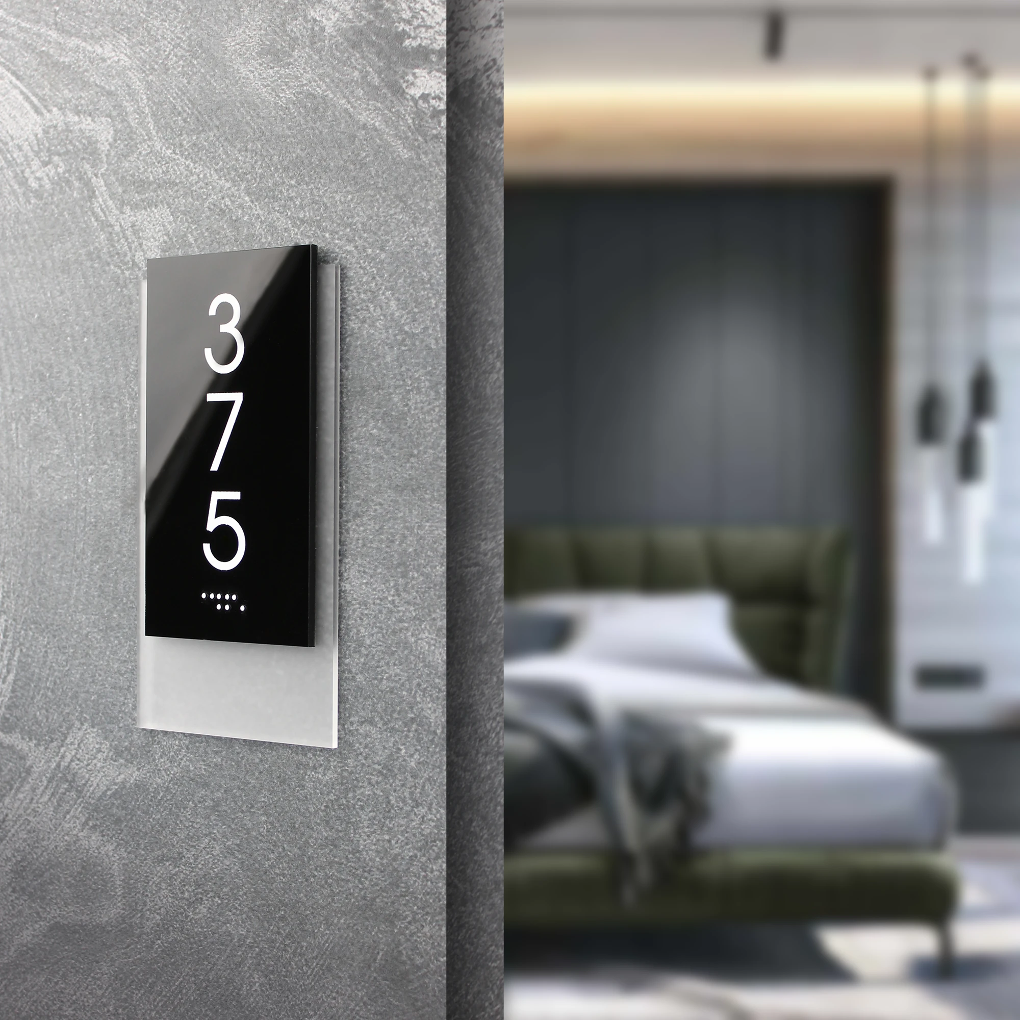 ADA room number sign 375, vertical black acrylic door sign with Braille