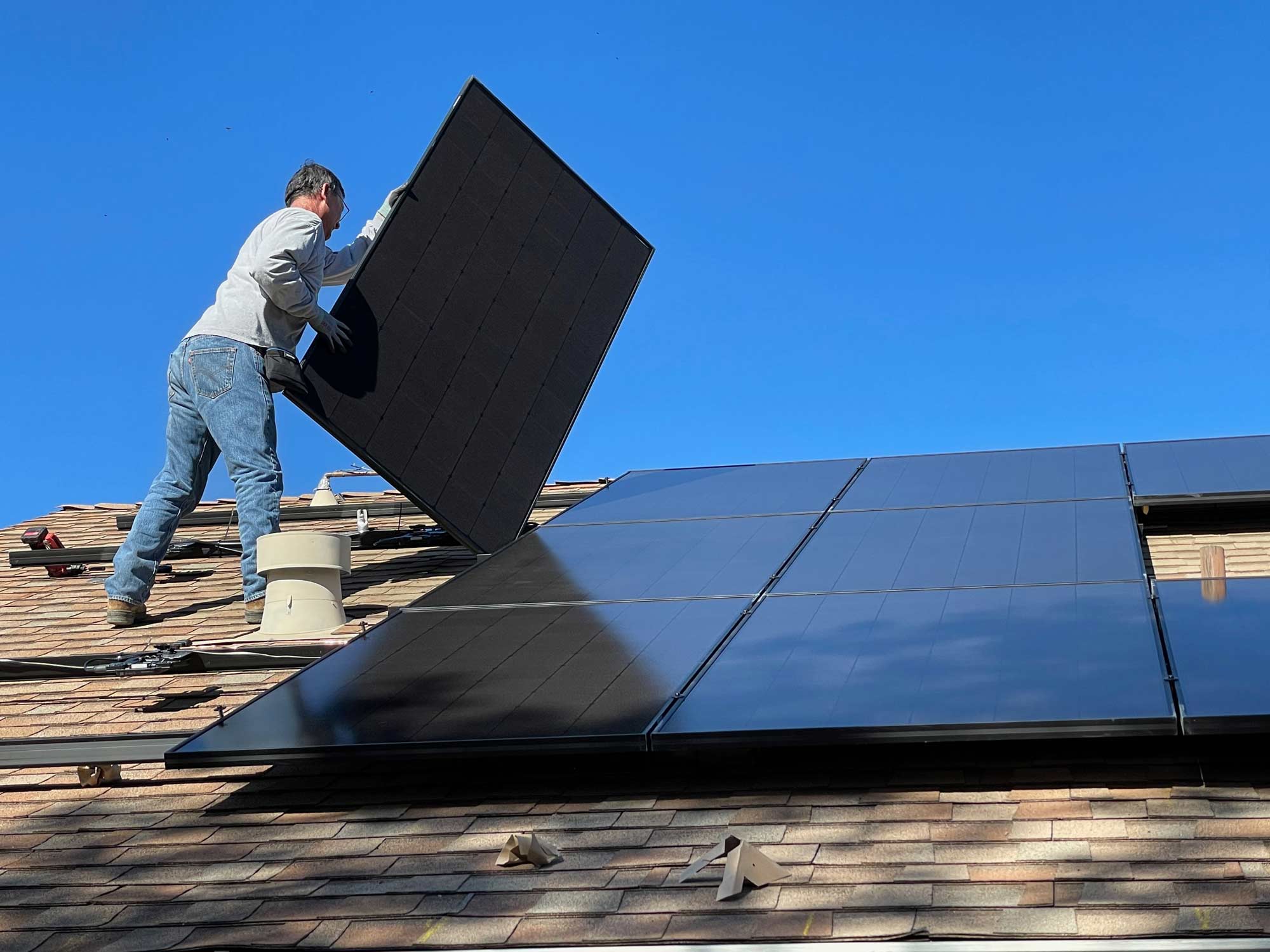 Man installing Solar Panels on Utah Home