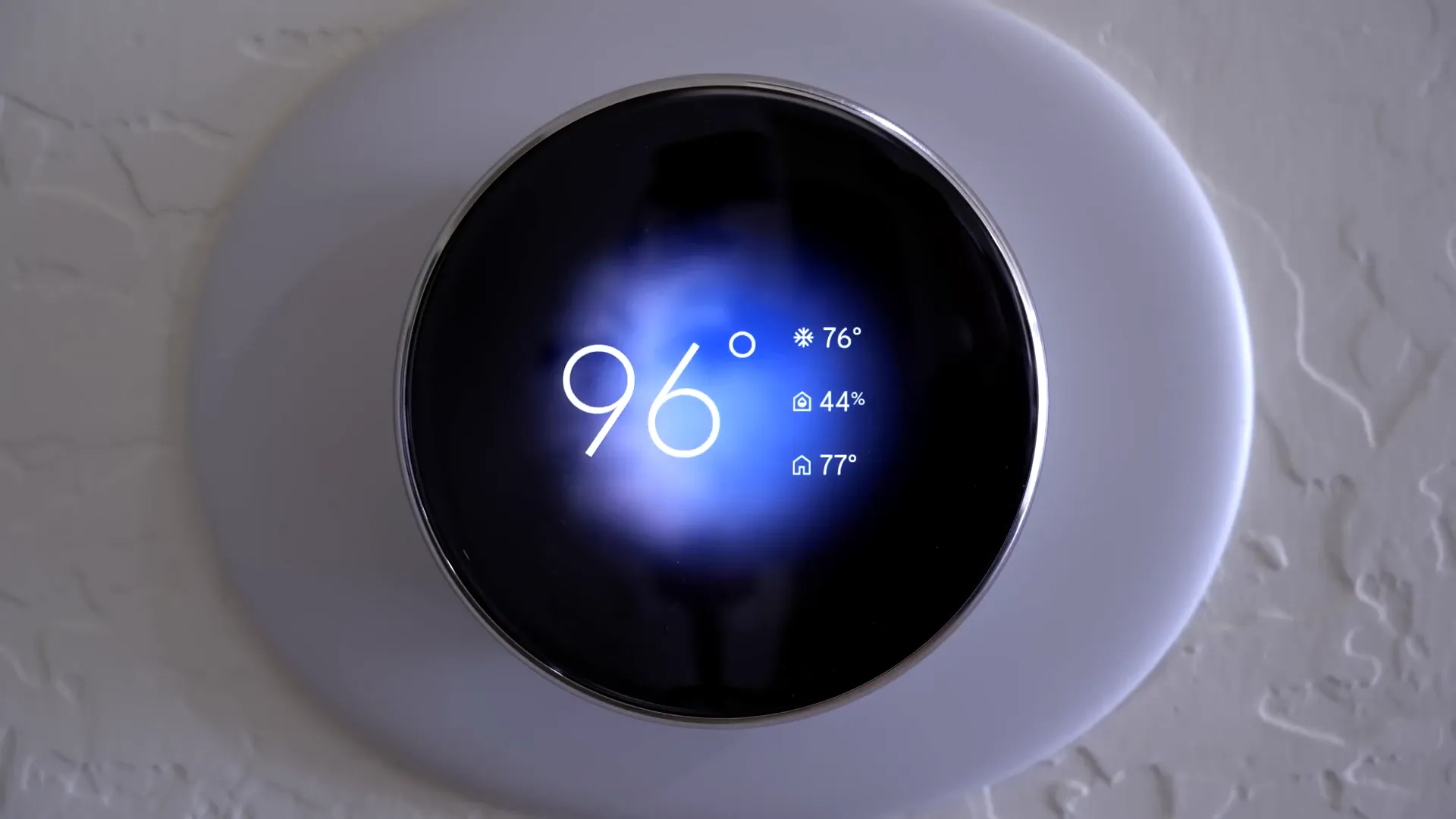 Nest thermostat Farsight display showing weather animation