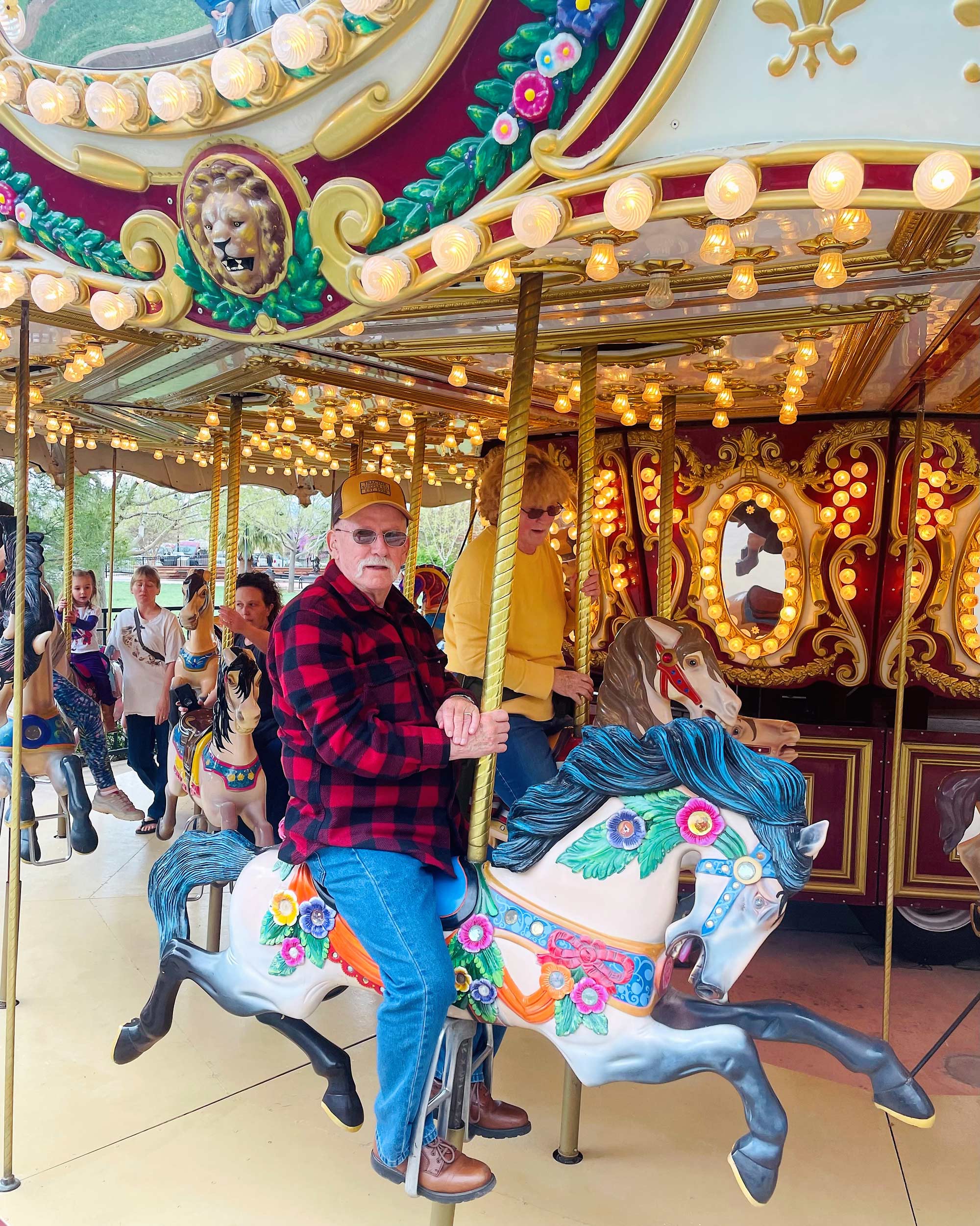 Old man riding Carousel