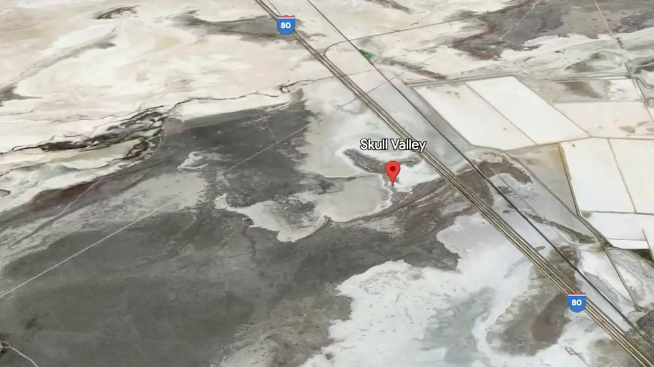 Paved section of Utah Motorsports Campus with grandstands in the background